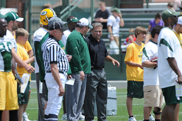 Dan Lauria and Packers Coach Mike McCarthy at practice on Lambeau Field.